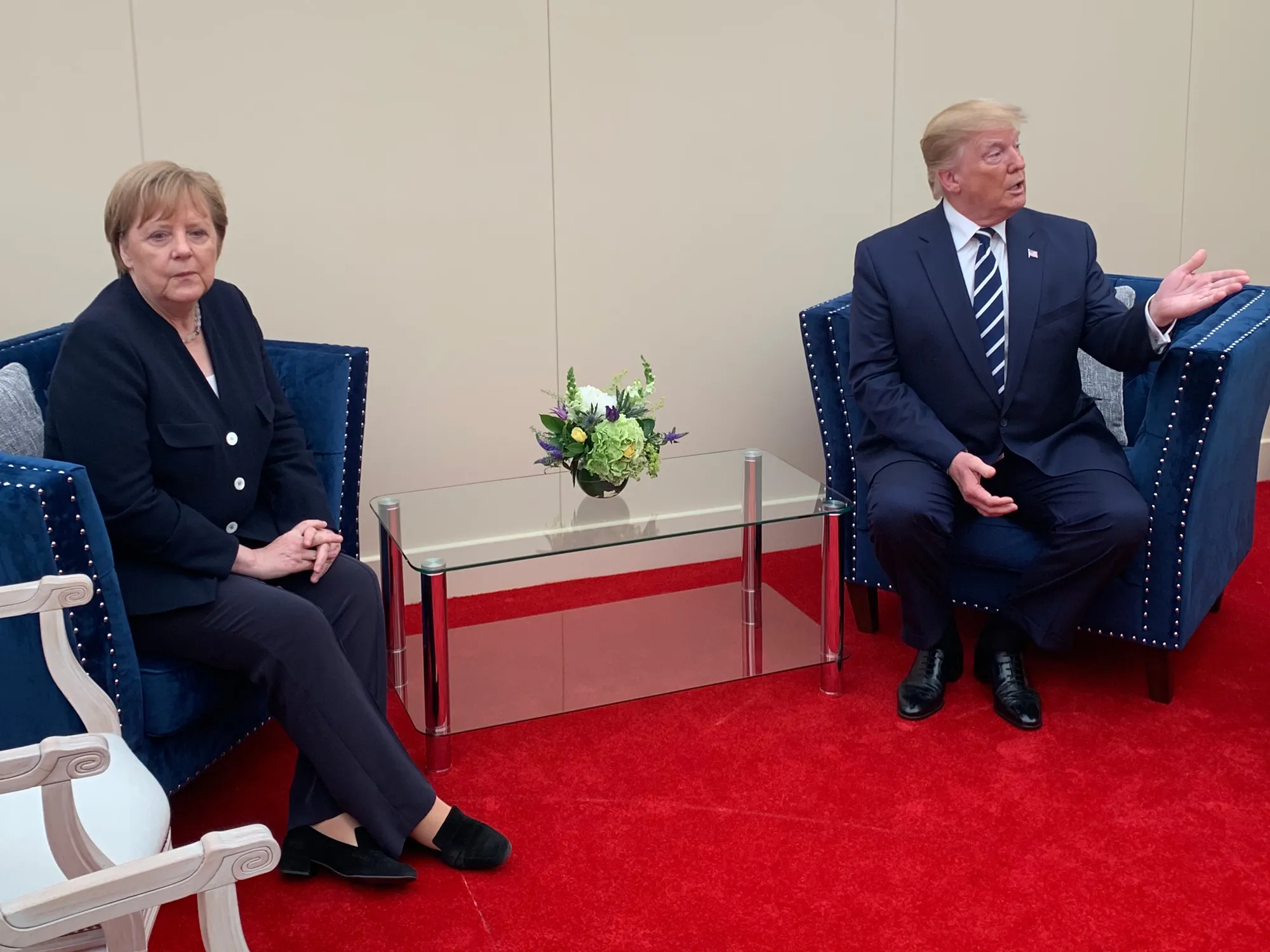 Angela Merkel and Donald Trump on the sidelines of the D-Day commemorations in Portsmouth on June 5.