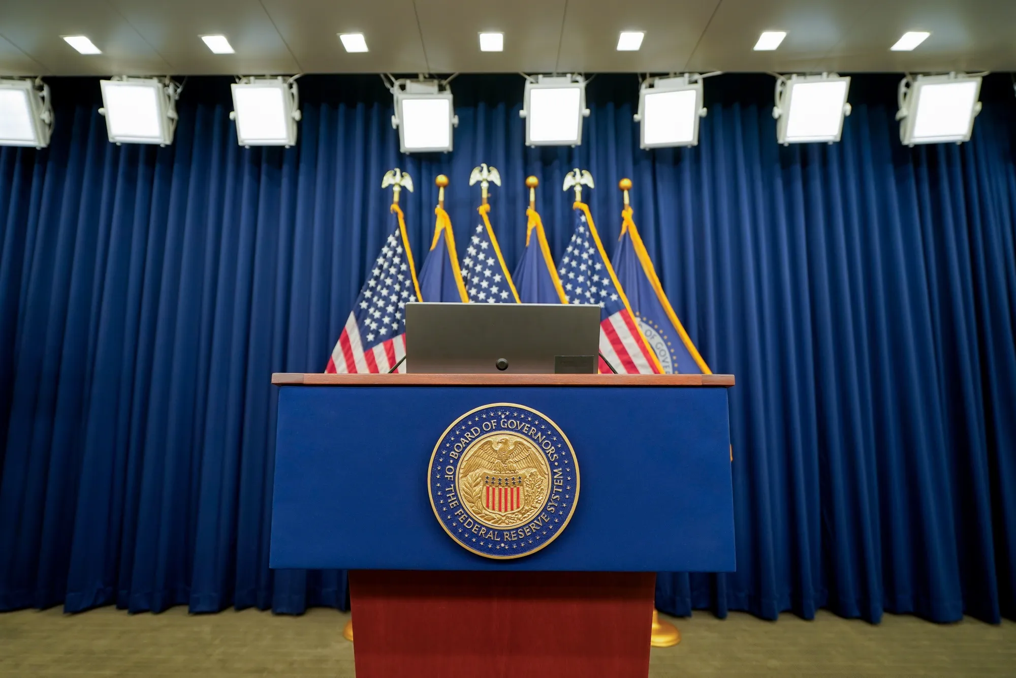 The seal of the Board of Governors of the Federal Reserve System on a podium in Washington.
