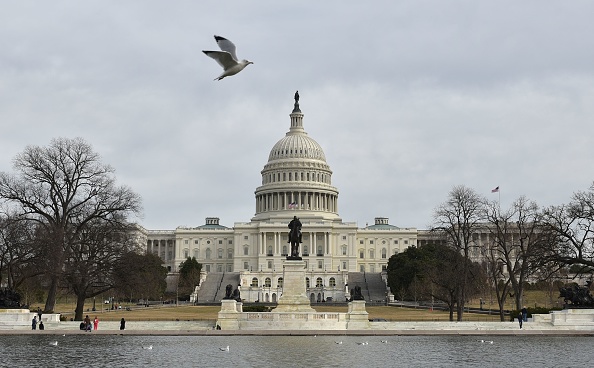 TOPSHOT - The US Capitol is seen in Washington, DC on January 22, 2018 after the US Senate reached a deal to reopen the federal government, with Democrats accepting a compromise spending bill. / AFP PHOTO / MANDEL NGAN        (Photo credit should read MANDEL NGAN/AFP/Getty Images)