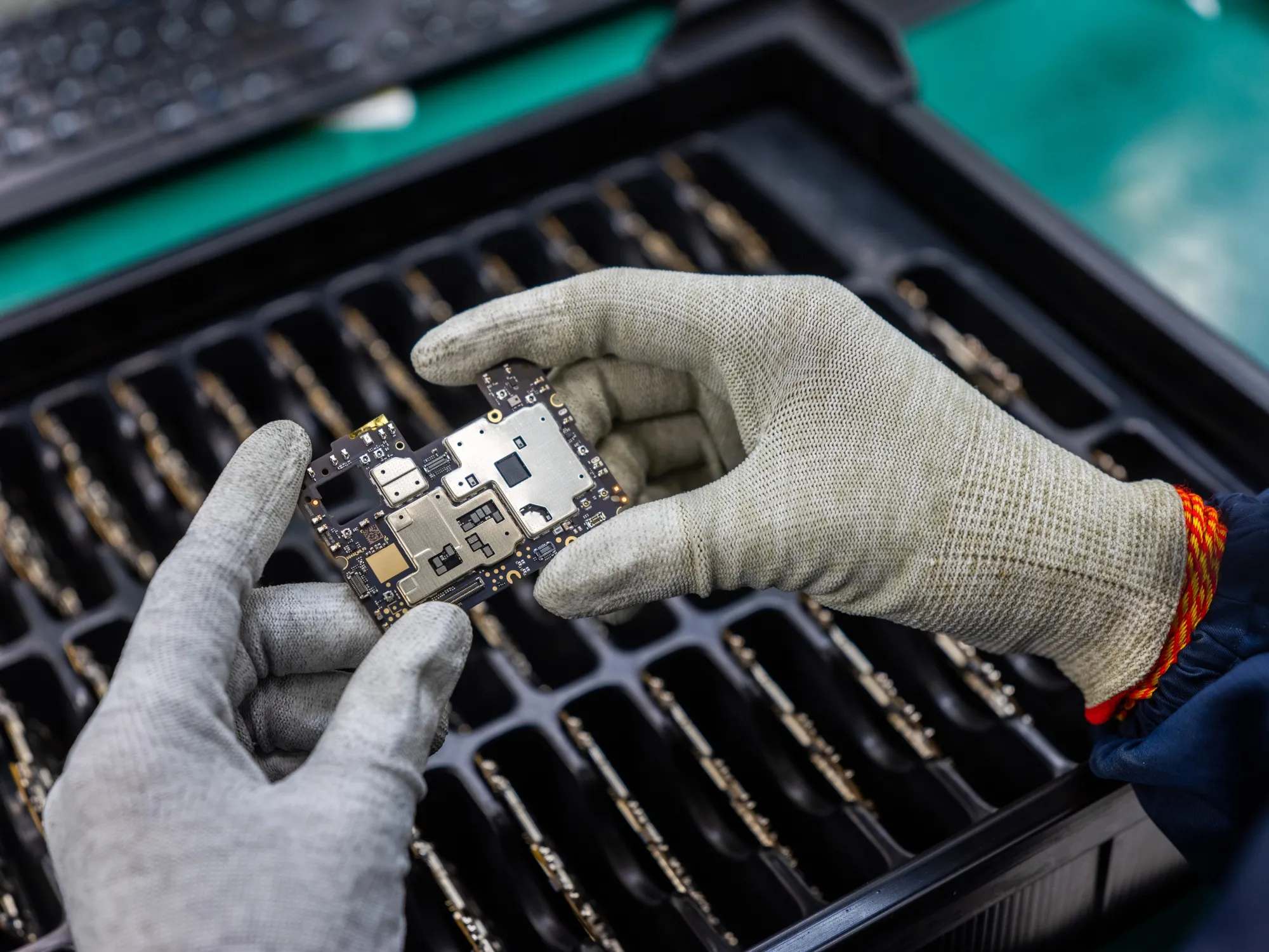 The latest plan will cover parts used in displays and camera modules, as well as enclosures of phones and laptops, and multi-layer printed circuit boards.&nbsp;