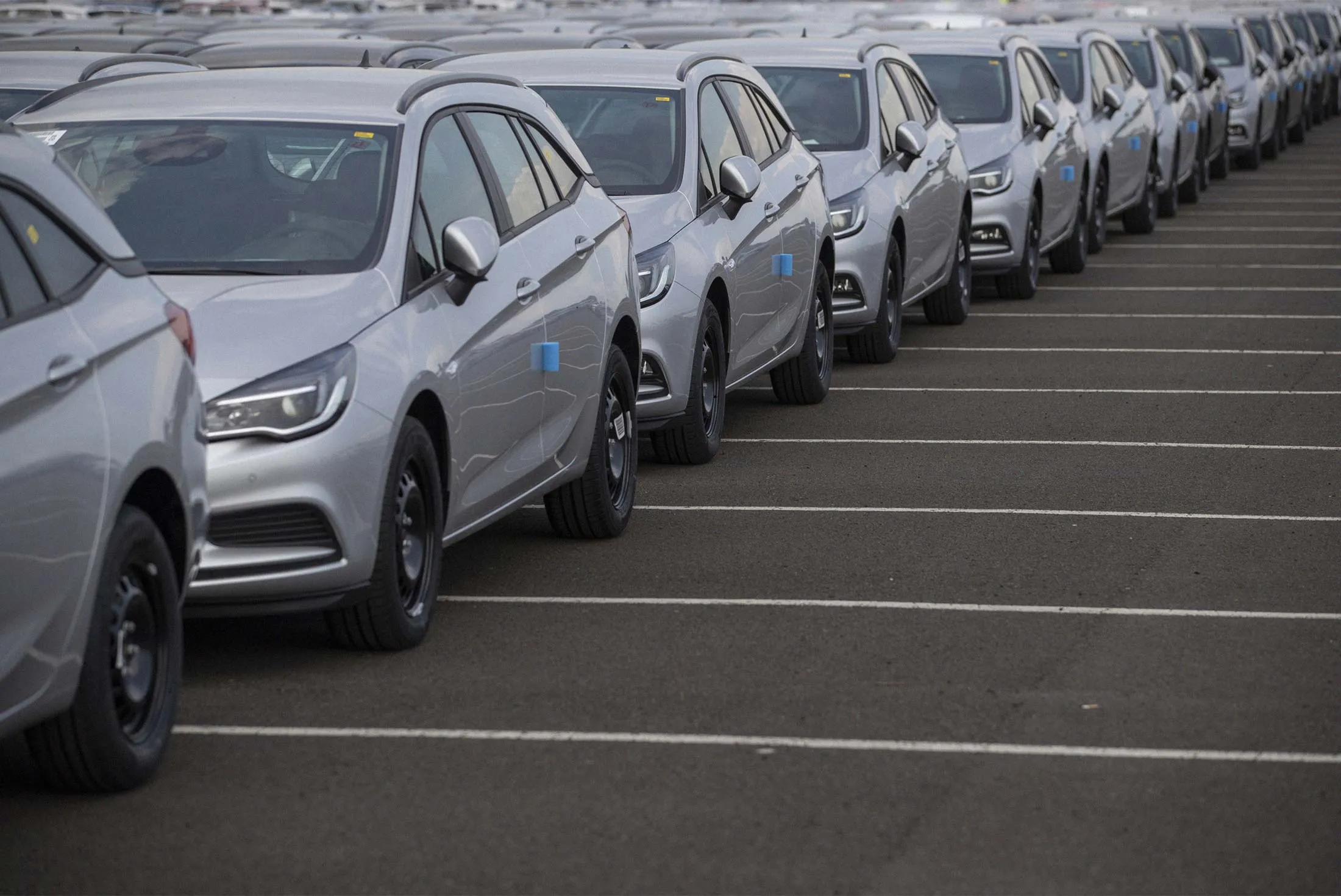New Opel automobiles in a dockside parking lot at the U.K.’s Port of Killingholme on July 19, 2018.&nbsp;