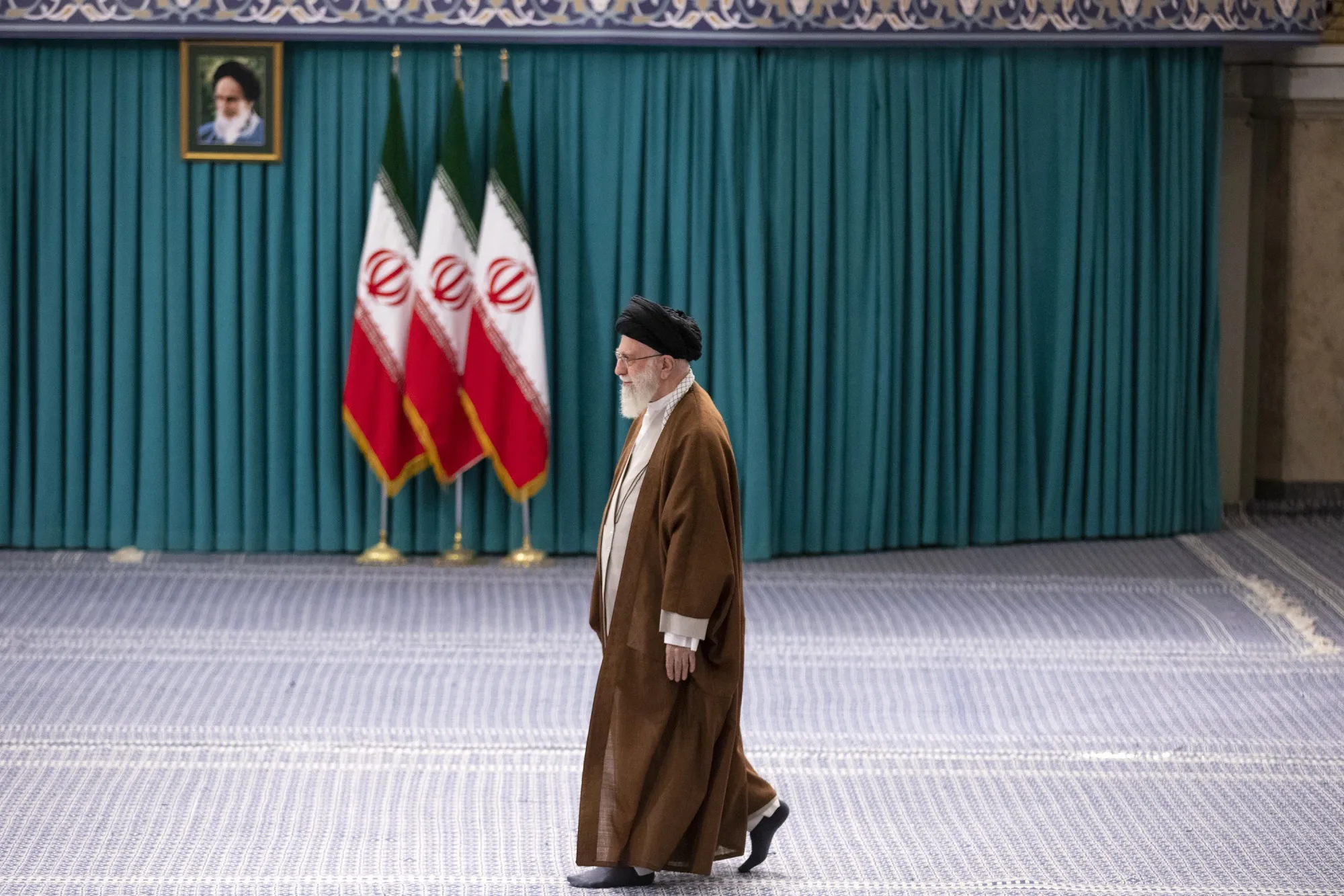 Iranian Supreme Leader Ayatollah Ali Khamenei arrives to vote in the parliamentary run-off elections in Tehran, on May 10.&nbsp;