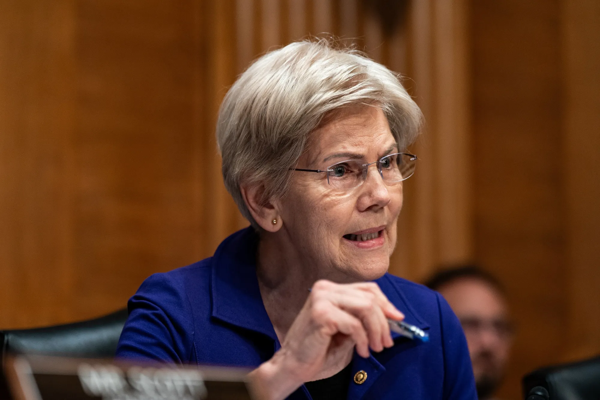 Warren Urges Fed's Cook to Turn on Key US Big-Bank Capital Buffer - Bloomberg