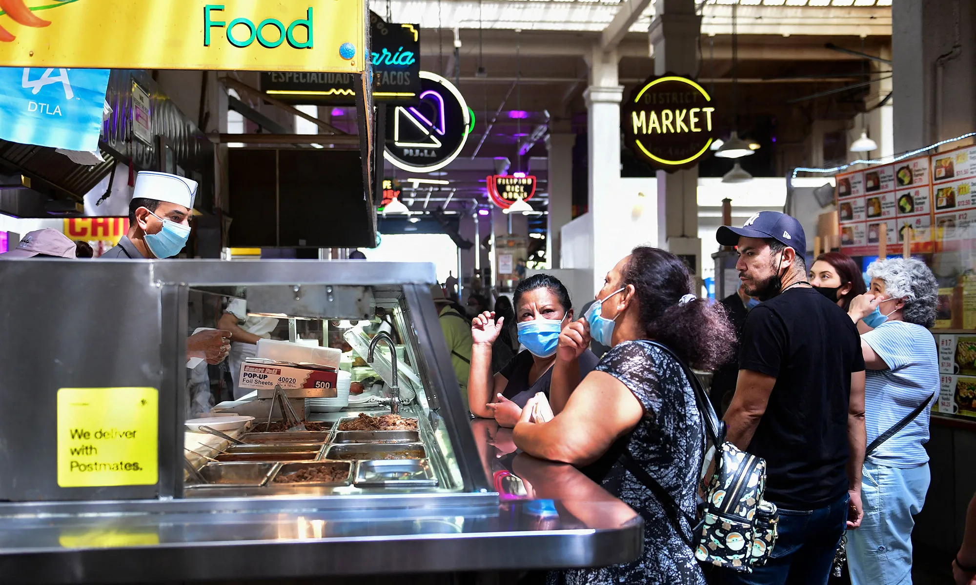 Face masks worn as people wait for their food at Grand Central Market in Los Angeles.&nbsp;