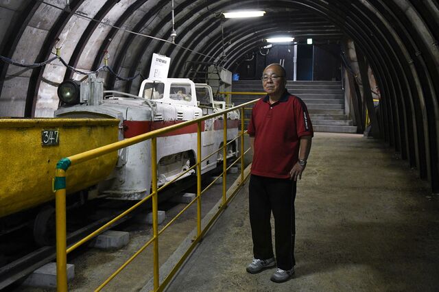 Akiyo Kuribayashi, stands inside the simulated mine inside the Taiheiyo Colloery exhibition in Kushiro city.  Hokkaido, Japan, on Saturday, July 8, 2023. Photographer: Noriko Hayashi/Bloomberg