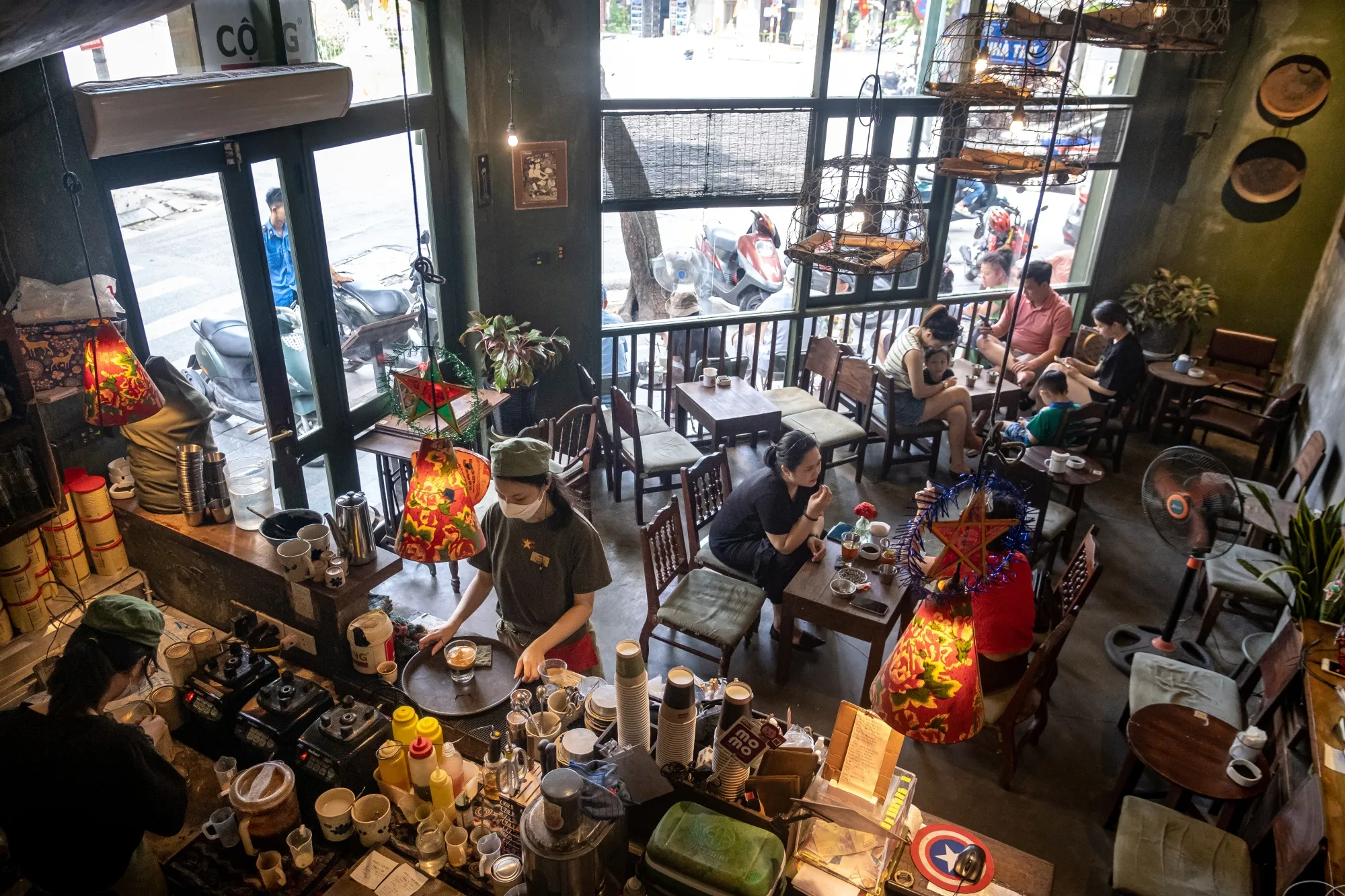 Customers at a coffee shop in Hanoi.