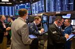 Traders work on the floor of the New York Stock Exchange (NYSE) in New York.