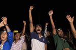 Demonstrators in Colombo cheer after hearing news about the resignation of Gotabaya Rajapaksa.