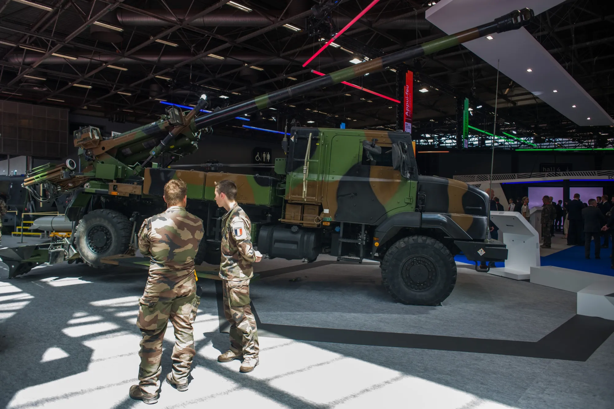 French efforts to spend more on defense comes against the backdrop of the political turmoil in the country.