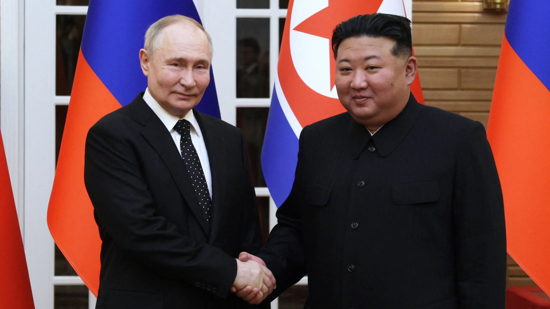 Kim Jong Un, right, and Vladimir Putin in a photo released by Russian state media on June 19.