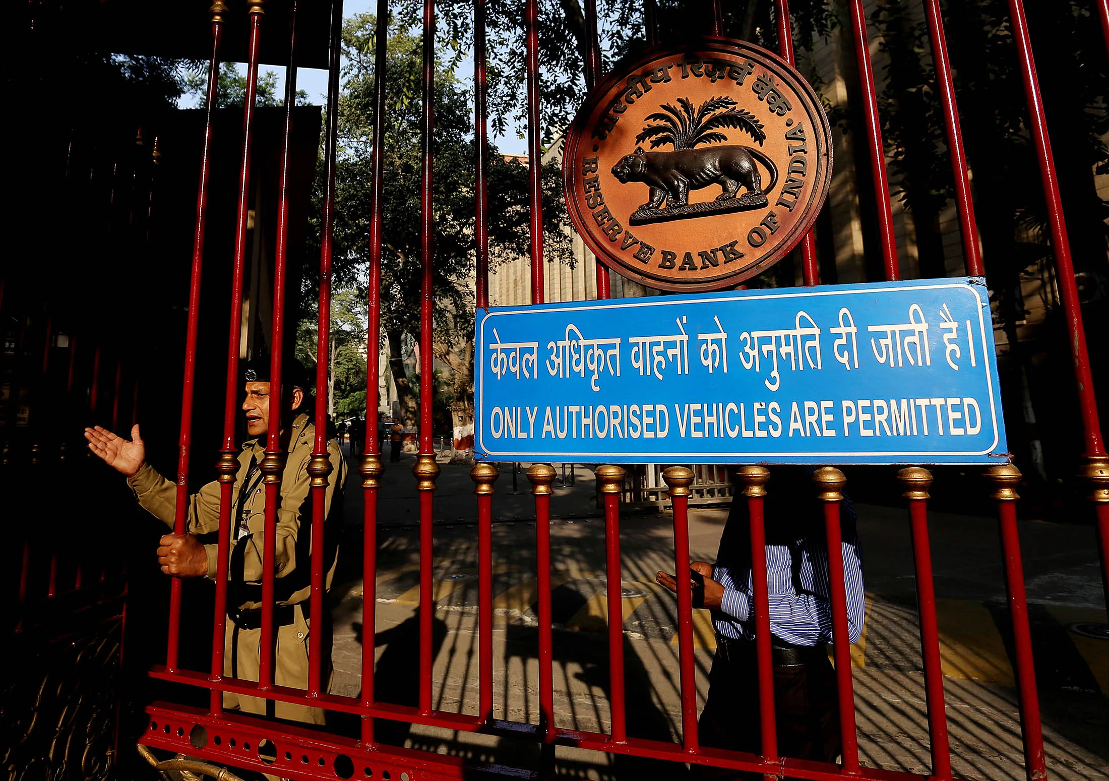 A security guard stands at the gate of the Reserve Bank of India headquarters in New Delhi.
