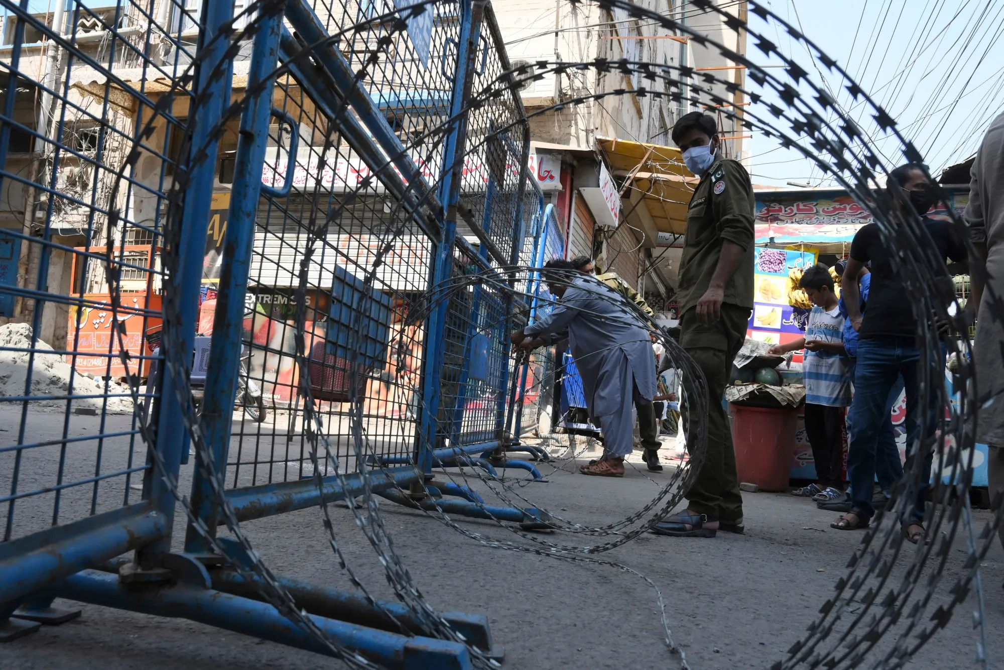 Policemen seal a street in Lahore, Pakistan following a rise in Covid-19 cases, in June 2020.