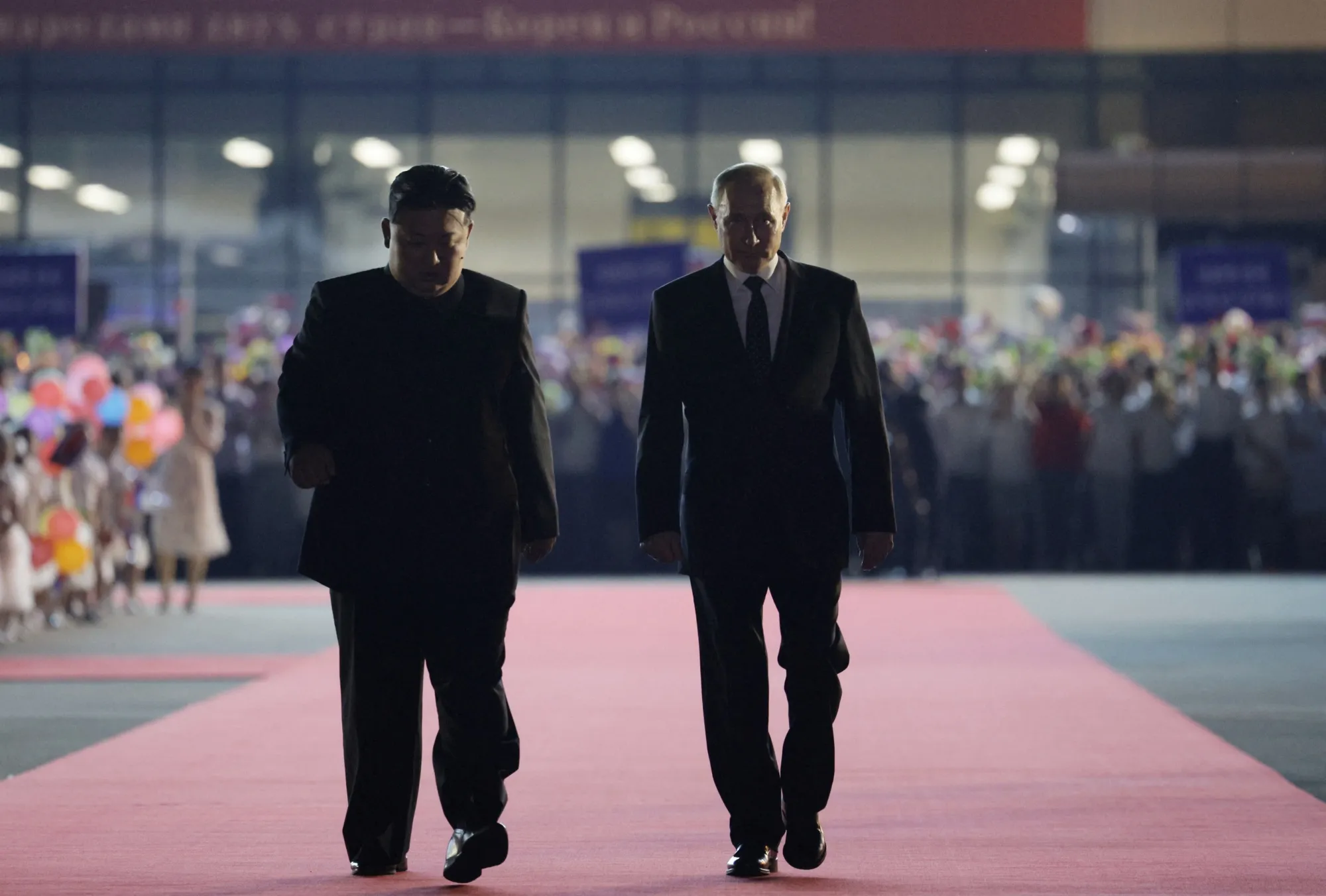 In a pool photograph distributed by the Russian state agency Sputnik, Vladimir Putin, right, with Kim Jong Un in Pyongyang, on June 19
