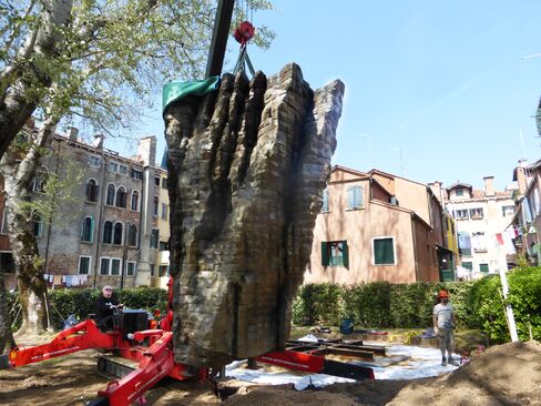 Lowering a sculpture into place. The sculptures required more than 12 tons of steel armature underground for support.