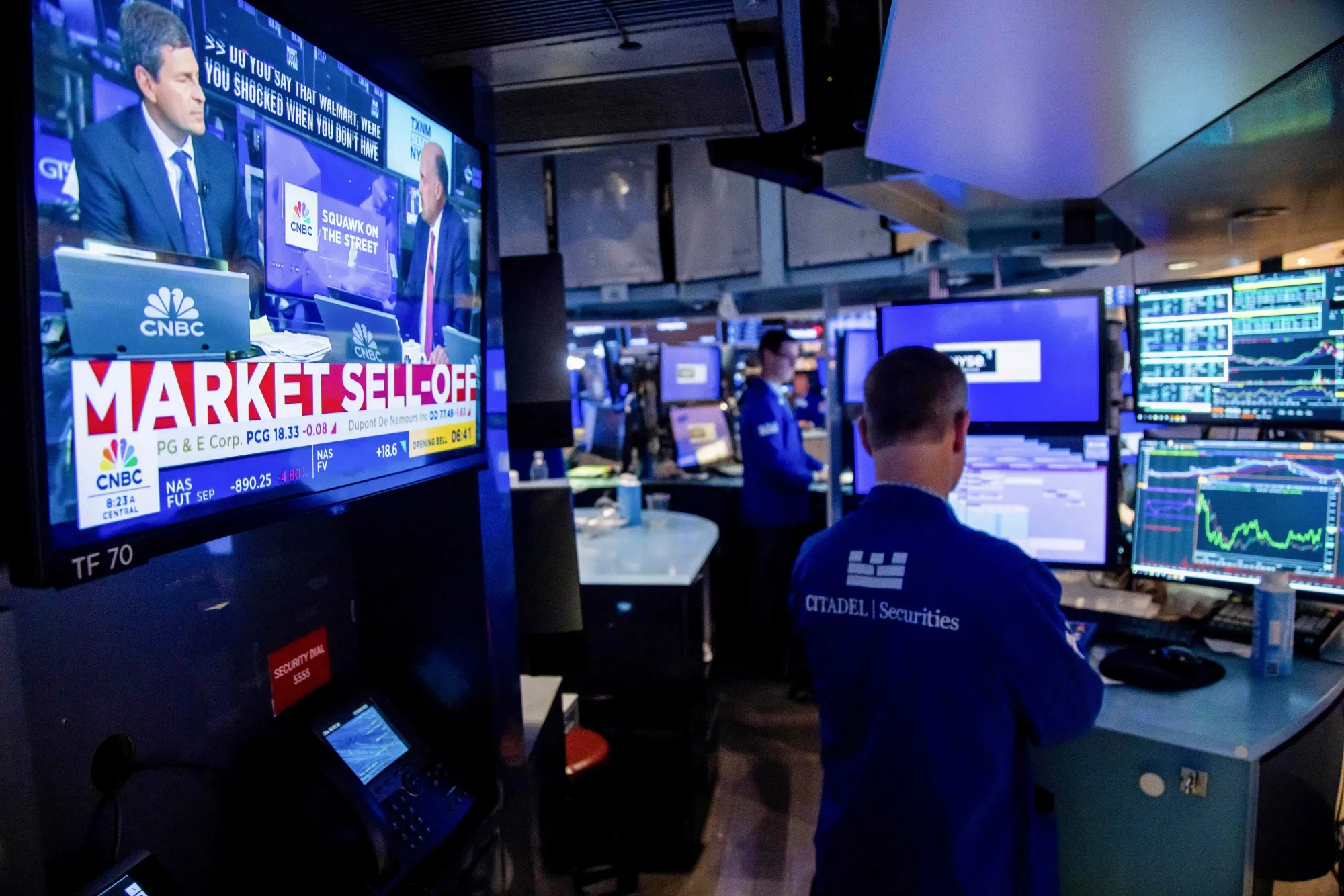 A television displays stock market news on the floor of the New York Stock Exchange in New York, on Aug. 5.