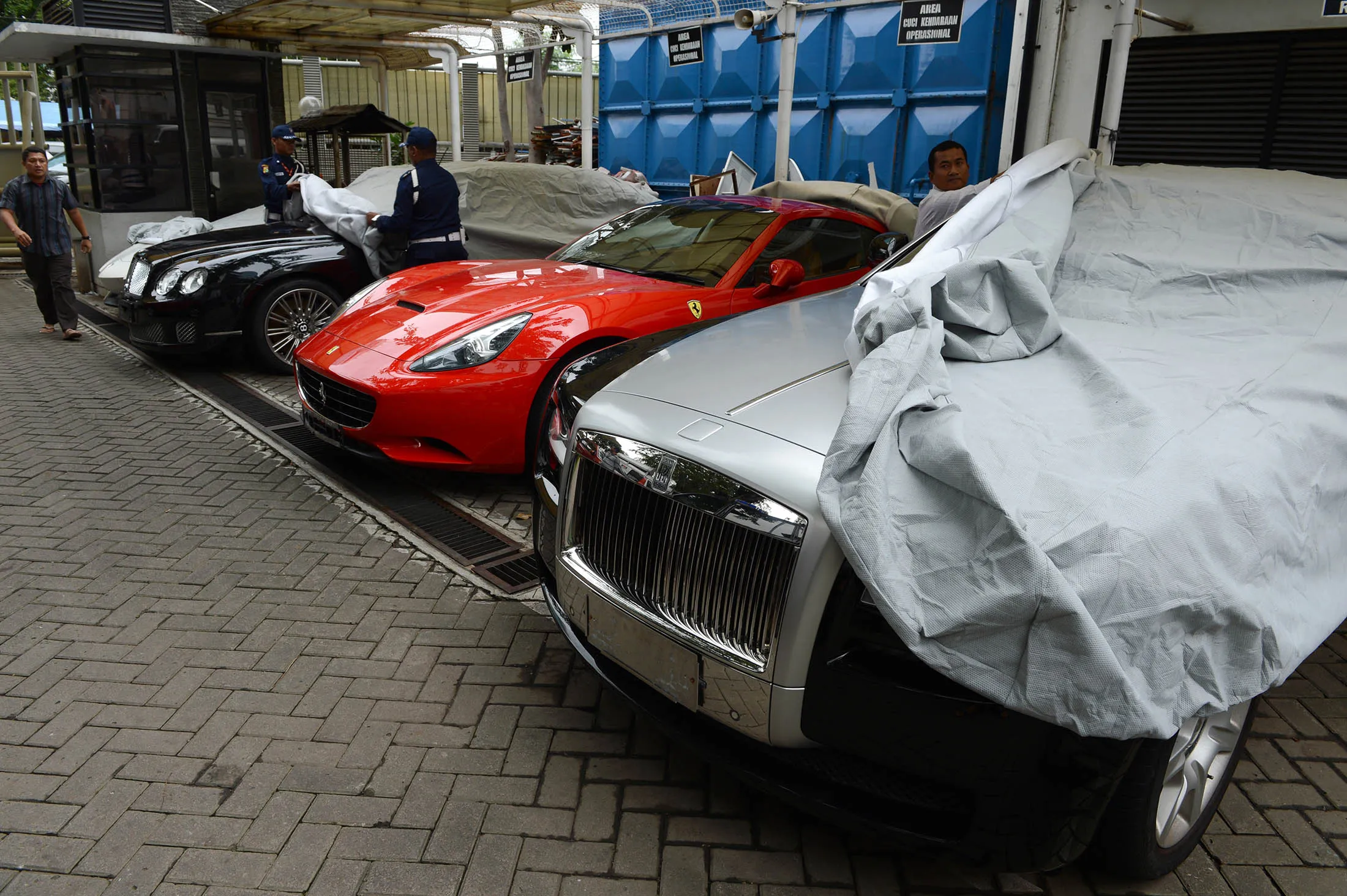 Several luxury vehicles at the compound of Indonesia's anti corruption agency in Jakarta. Indonesia plans to get back stashed overseas money and increase domestic tax revenue by using an ambitious amnesty plan aimed at raising $165 trillion rupiah ($12.5 billion) before it ends in March.
