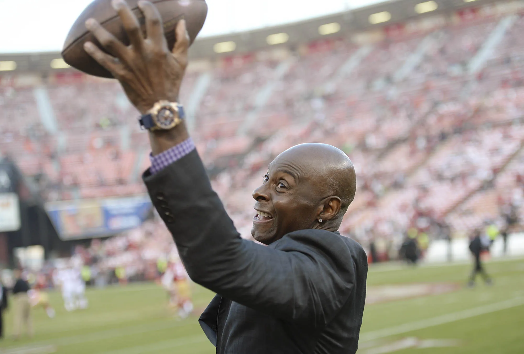 Hall of Famer and former San Francisco 49er Jerry Rice catches passes prior to the start of an NFL game in San Francisco.