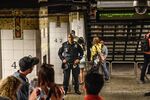 A New York Police Department officer patrol inside the Times Square subway station in New York.