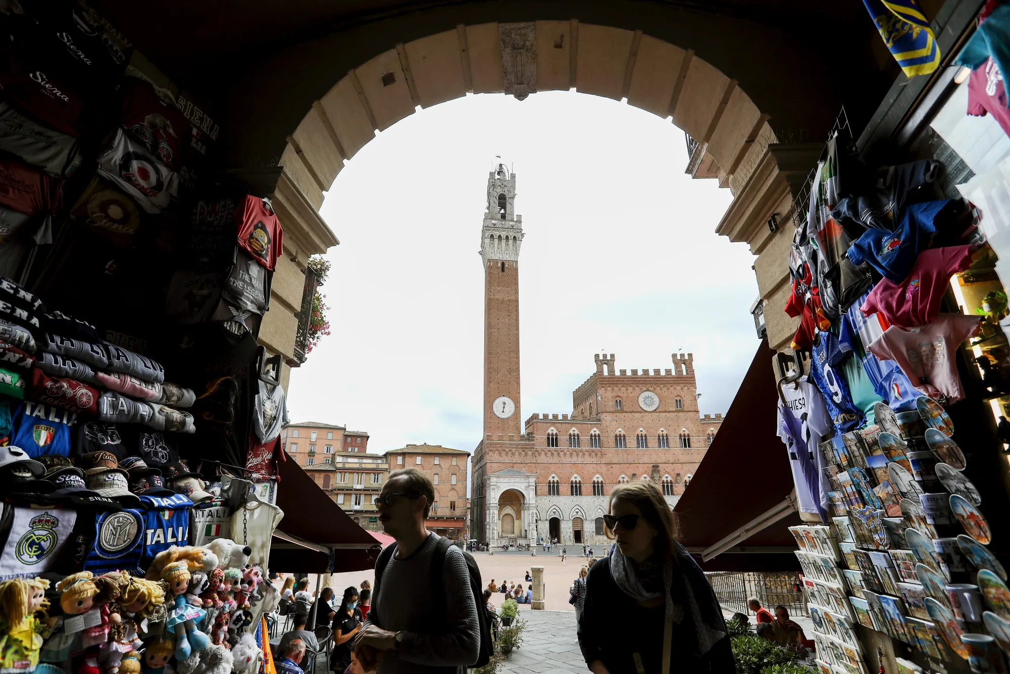 A souvenir stall on the edge of Piazza del Campo square in Siena, Italy.