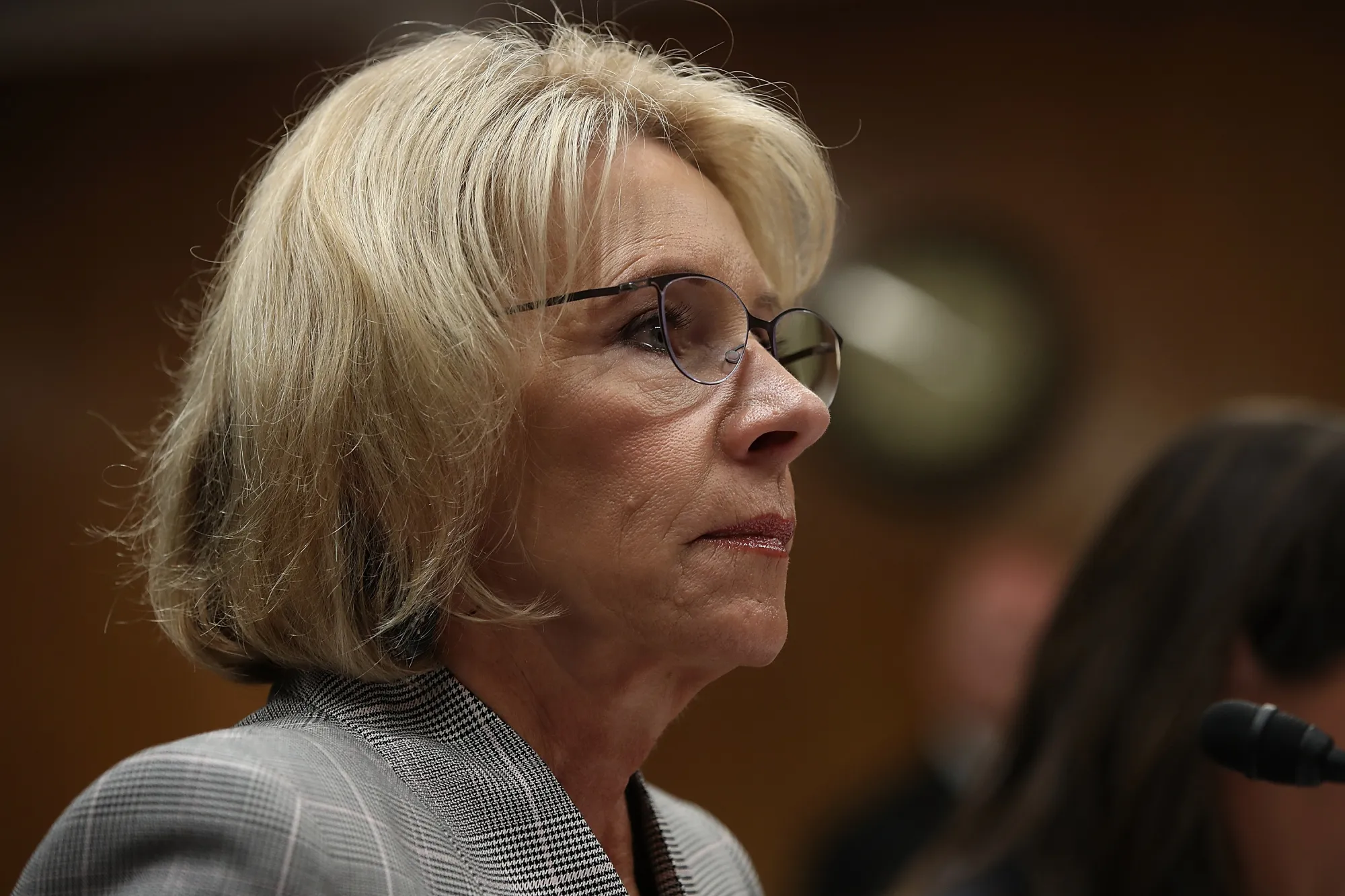 Turning her back on students.
