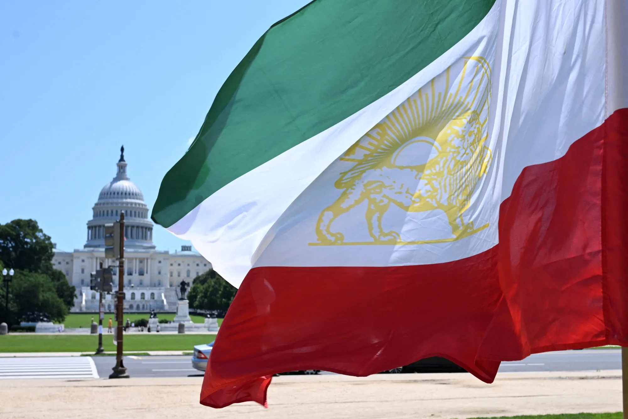 The old flag of Iran used prior to the 1979 Islamic Revolution on the National Mall in front of the US Capitol in Washington.