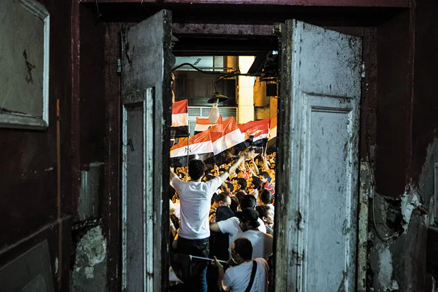 Protesters cheer near Tahrir Square for Mursi’s ouster
