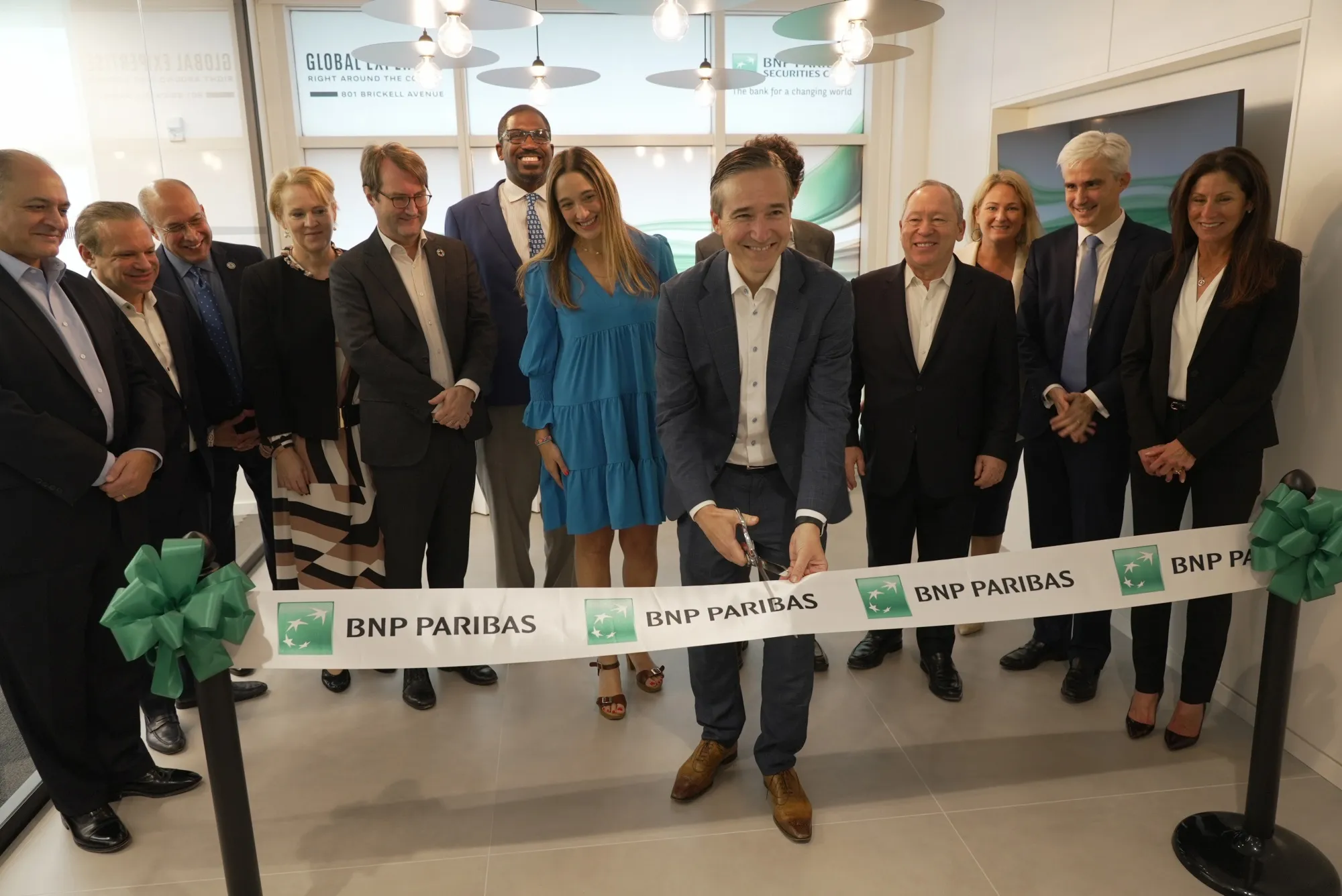 Senior BNP Paribas executives including Annabella Espina, middle left, and Matt O’Connor, center, at the ribbon cutting for the bank’s offices in the Brickell Avenue area of Miami in 2023.
