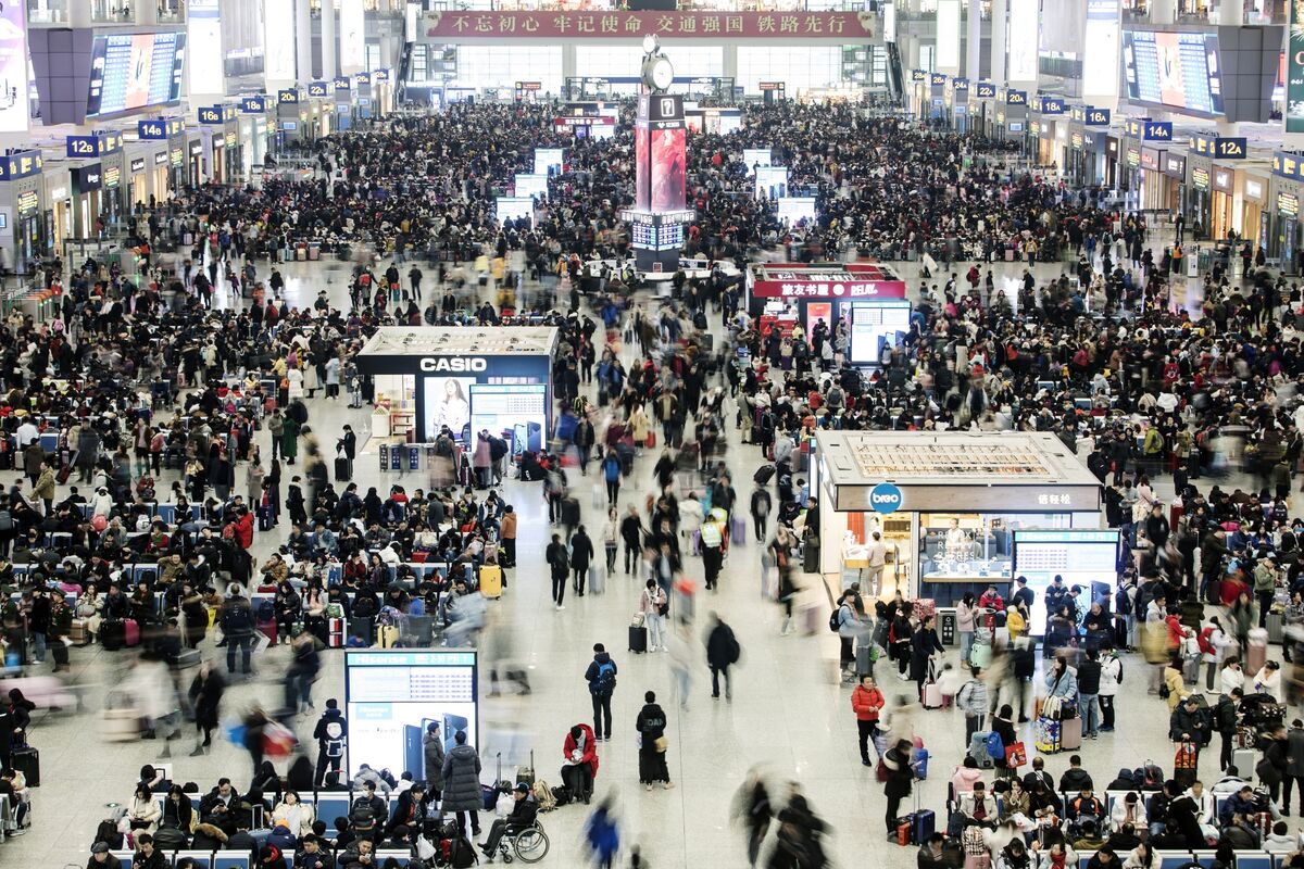 Travelers walk through the main hall of the Hongqiao Railway Station in Shanghai on Jan. 18.