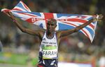Britain's Mo Farah celebrates winning the gold medal in the men's 10,000-meter final during the athletics competitions of the 2016 Summer Olympics at the Olympic stadium in Rio de Janeiro, Brazil, Saturday, Aug. 13, 2016. Four-time Olympic champion Mo Farah has disclosed he was brought into Britain illegally from Djibouti under the name of another child. The British athlete made the revelation in a BBC documentary. (AP Photo/Kirsty Wigglesworth, File)