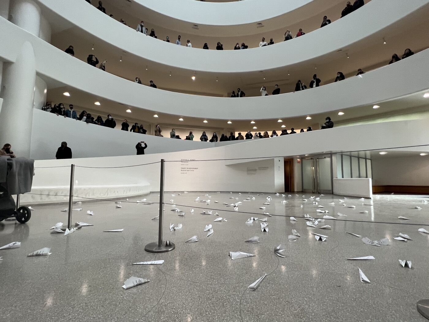 Museum patrons watch a “paper planes” protest organized by Ukrainian artists at the Solomon R. Guggenheim Museum in New York City on March 5, 2022. 