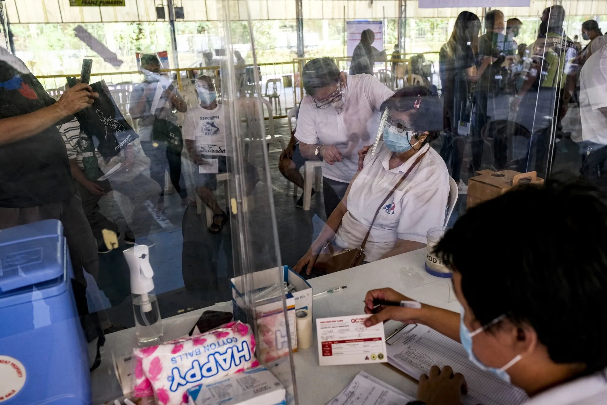 Senior citizens and people with comorbidity receive the second dose of the Sinovac Biotech Ltd. Covid-19 vaccine at a health clinic in Quezon City, Metro Manila, on May 11.
