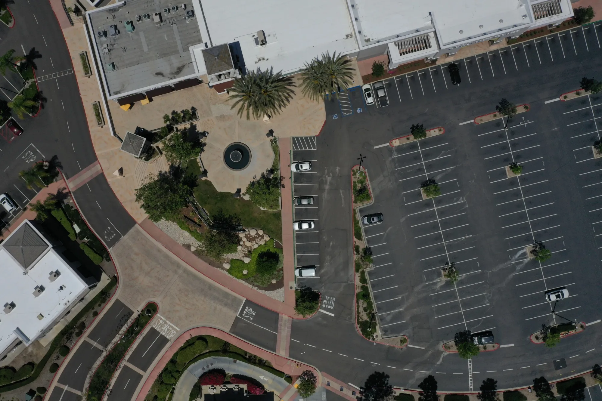 A nearly-empty parking lot at a shopping complex in San Diego.