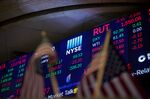Monitors display stock market information on the floor of the New York Stock Exchange (NYSE)