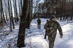 The Ukrainian Border Guard patrol along the Ukrainian border fence at a border crossing between Ukraine, Russia and Belarus, in Senkivka, Ukraine, on Feb. 14.