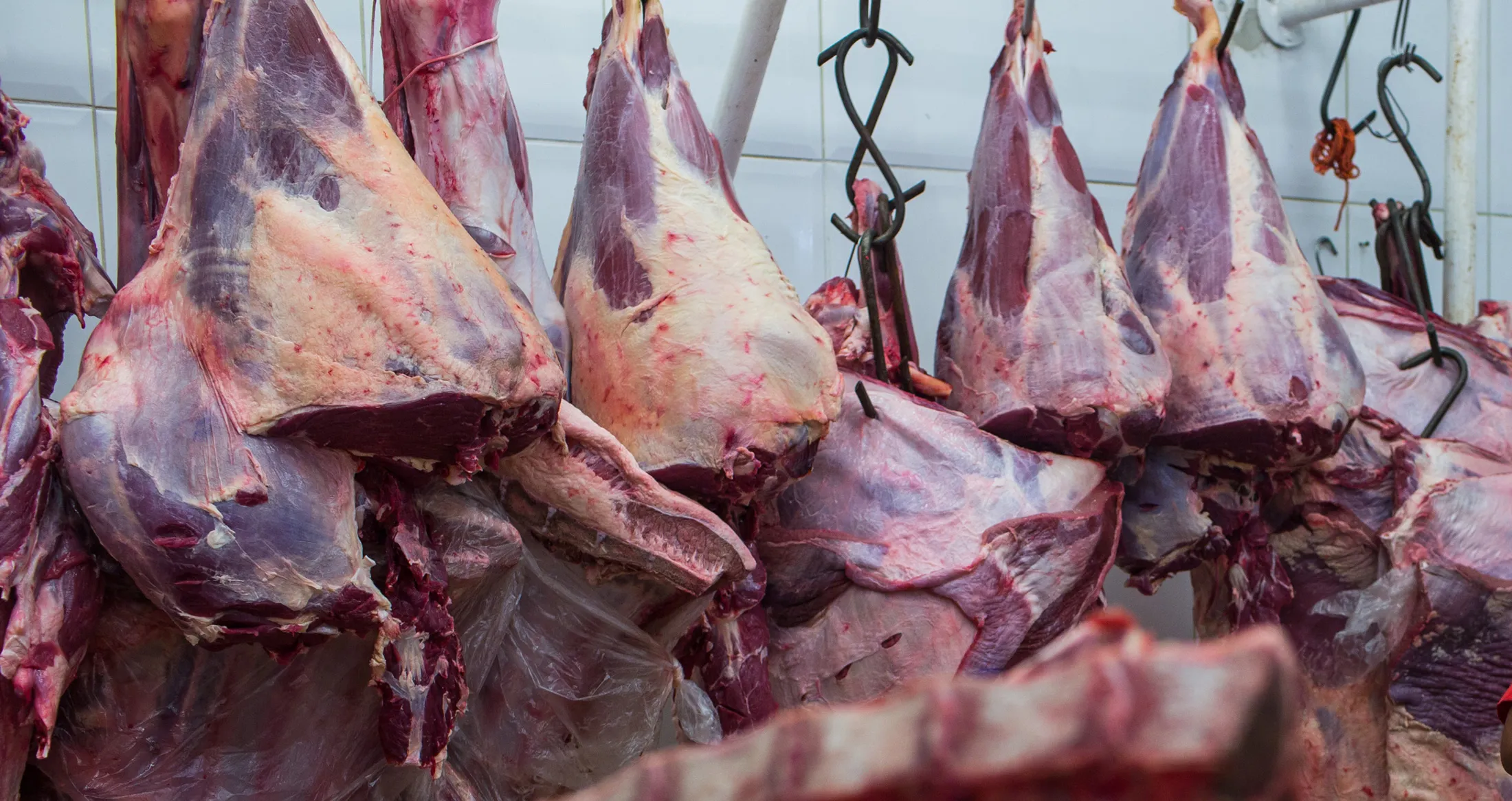 Meat hangs on display for sale at a butchery stall in Sao Paulo, on March 17.
