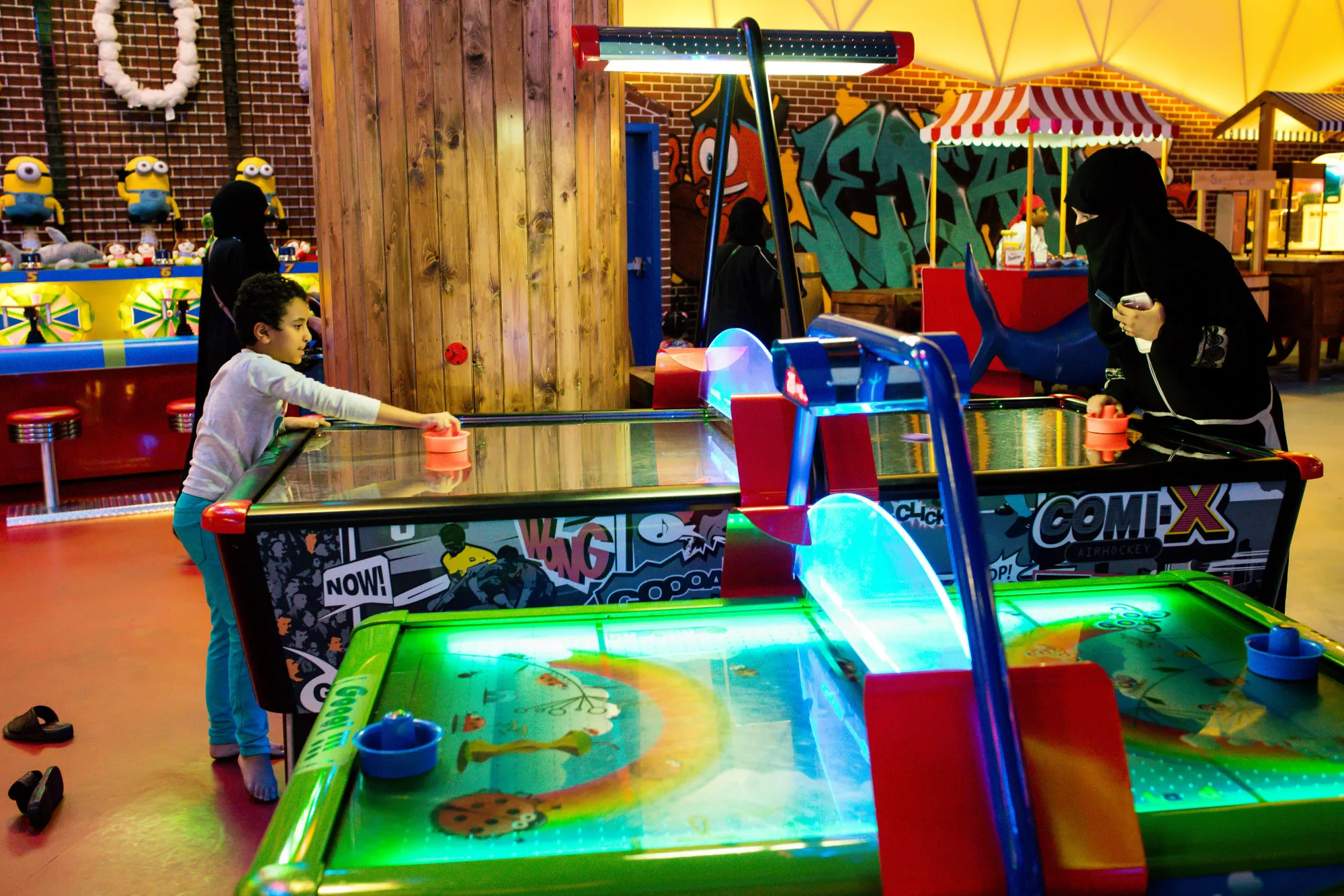 Visitors play air hockey at a indoor family theme park in the Al Yasmin mall in Jeddah, Saudi Arabia.