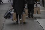Shoppers carry bags on Fifth Avenue in New York.