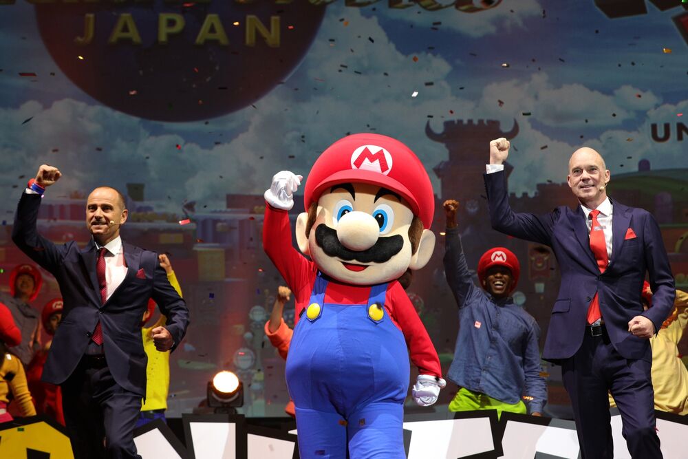 Thierry Coup, from left, Super Mario character and J.L. Bonnier at the Universal Studios Japan theme park in Osaka, Japan, on Jan. 14.