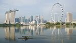Kayakers row past the central business district at Marina Bay in Singapore in October. 