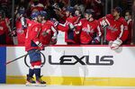 Washington Capitals left wing Alex Ovechkin (8) celebrates his goal with teammates in the first period of an NHL hockey game against the Winnipeg Jets, Tuesday, Jan. 18, 2022, in Washington. (AP Photo/Patrick Semansky)