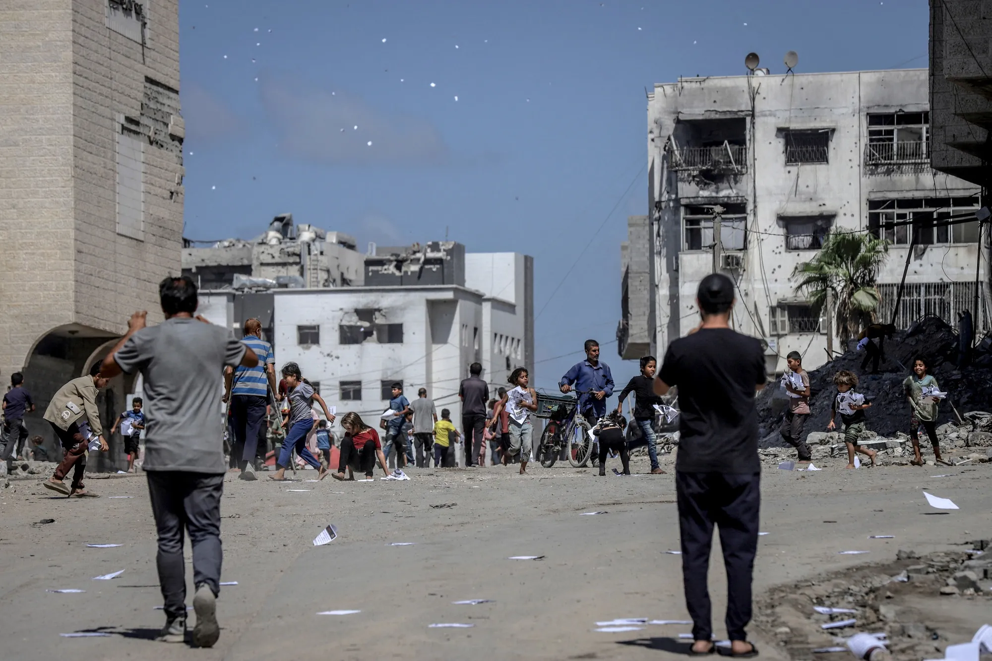 Leaflets dropped by Israeli forces to warn civilians to evacuate to the southern part of the Gaza Strip, in Gaza City, on Sept. 30.&nbsp;