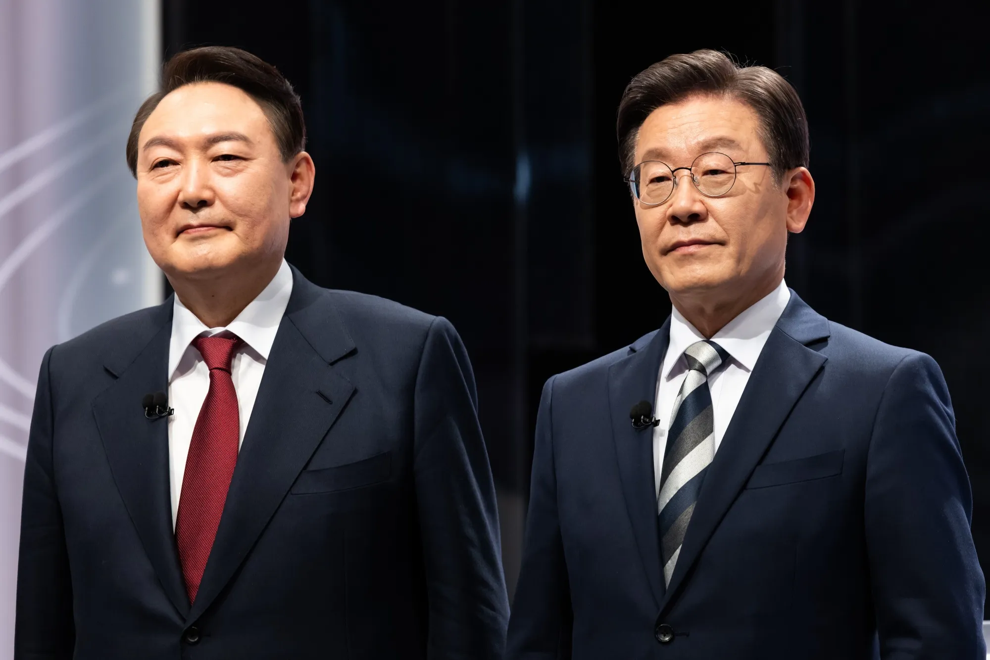 Lee Jae-myung, right, and Yoon Suk-yeol, during a presidential debate in Seoul, on Feb. 25.