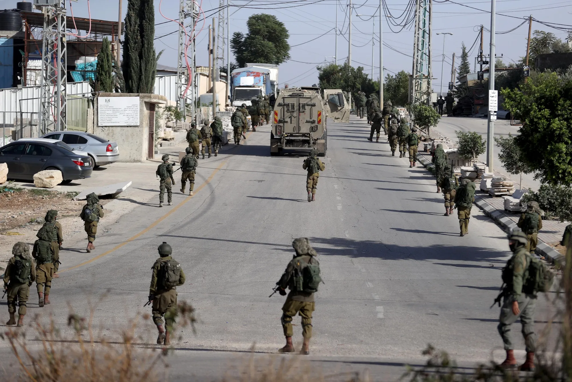 Israeli soldiers withdraw after a pre-dawn raid into the Balata refugee camp in eastern Nablus city, in the north of the West Bank, on Nov. 23.&nbsp;