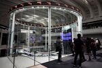 Visitors look at the trading floor at the Tokyo Stock Exchange.
