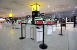 Virgin Australia self-service check-in kiosks stand idle at Melbourne Airport on March 23.