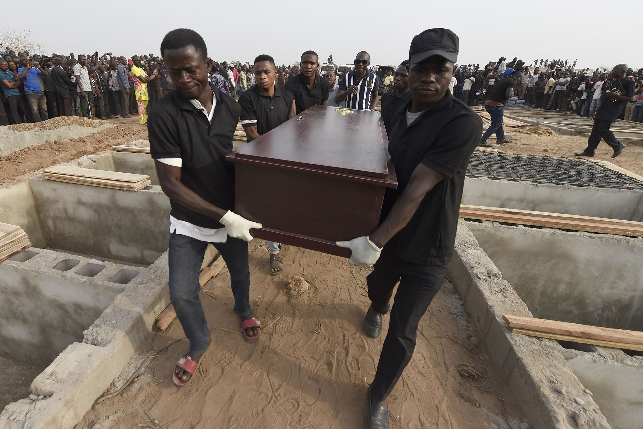 Pall bearers during the funeral service for people killed during cattle herder-farmer clashes in January 2018.