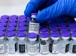 ERFURT, GERMANY - APRIL 08: Medical Staff prepares a vial of the Pfizer/BioNTech Comirnaty vaccine against Covid-19 at a vaccination center at the Messe trade fair grounds during the third wave of the coronavirus pandemic on April 8, 2021 in Erfurt, Germany. German authorities are expecting a strong increase in the volume of inoculations in April as vaccine supplies stabilize. Germany began vaccinations in late December and authorities predict as many vaccine doses to arrive in April as in the three months before. So far about 13% of people in Germany have received a first dose. (Photo by Jens Schlueter/Getty Images)