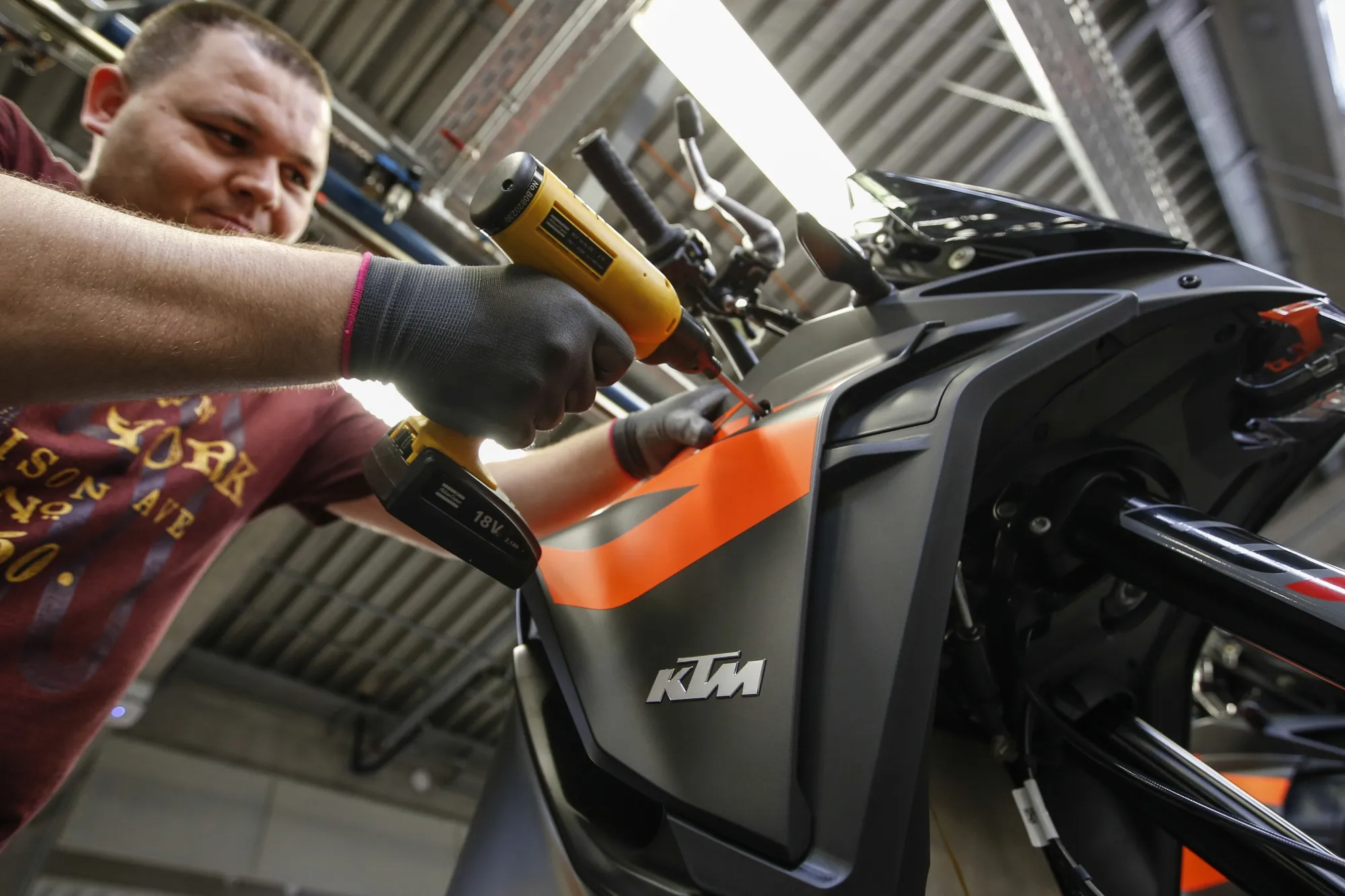 An employee at work on a KTM motorbike in a&nbsp;facility in Mattighofen, Austria, in 2019.