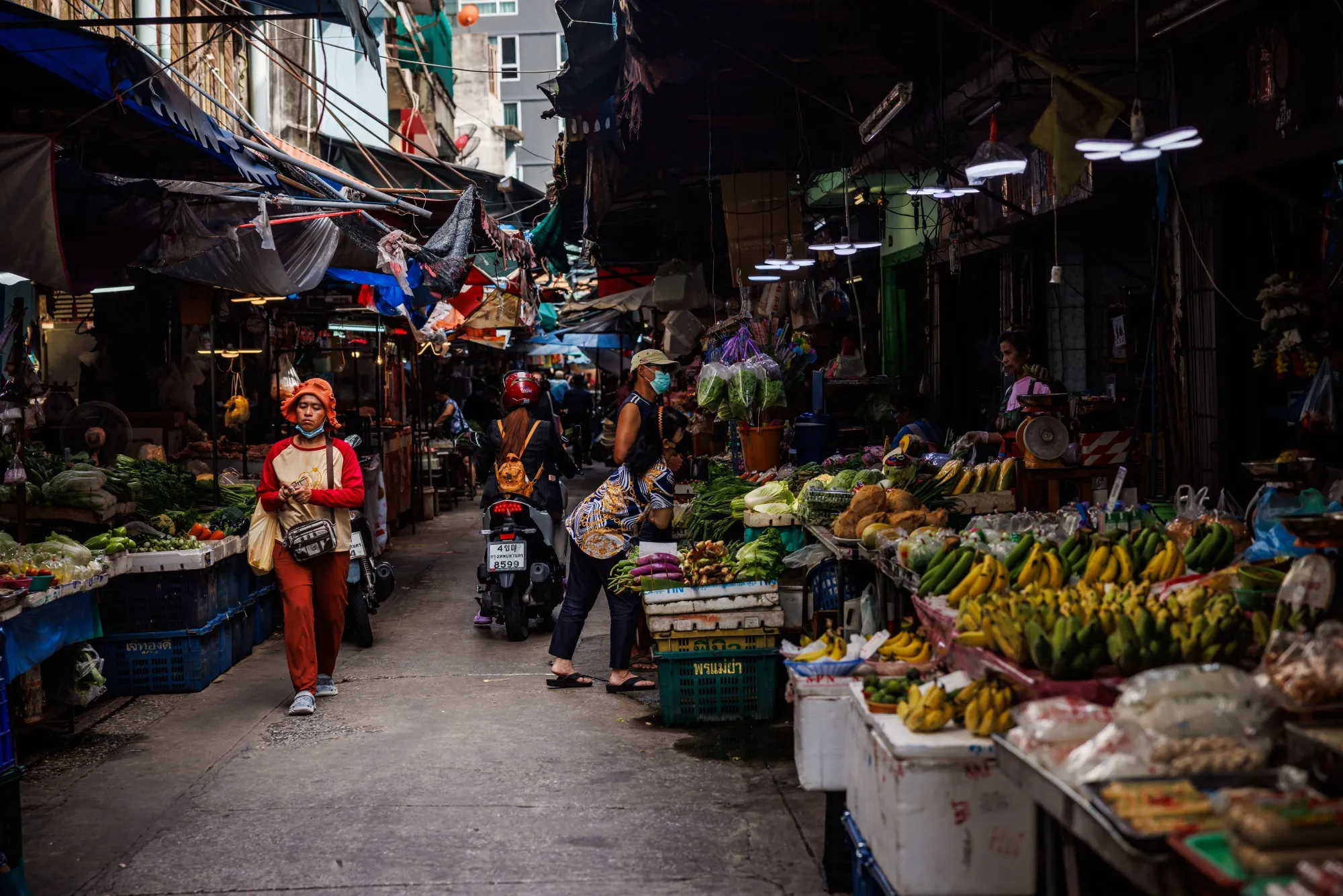 Shoppers at a morning market in Bangkok, Thailand.