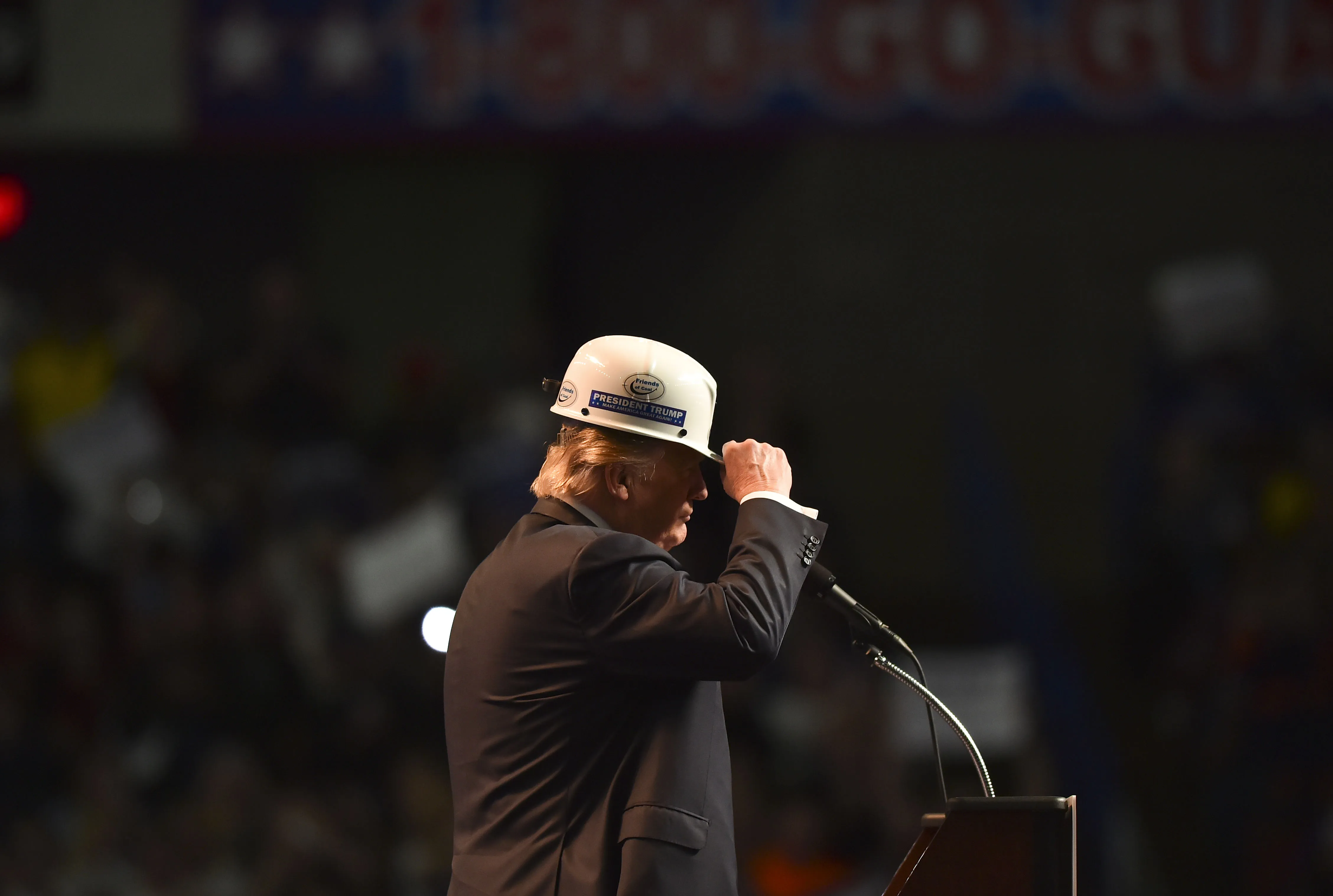 Donald Trump wears a coal miner's hardhat while addressing his supporters during a rally at the Charleston Civic Center on May 5, 2016 in Charleston, West Virginia.